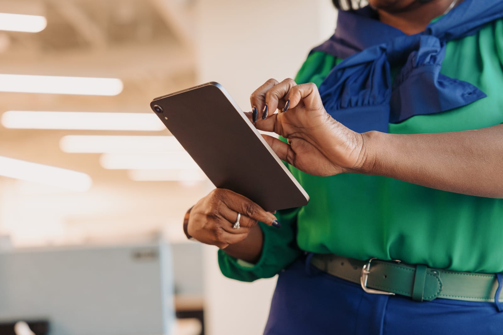 Woman navigating a tablet device comfortably using accessible gestures